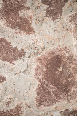 Arka plan olarak kırmızı granit taş duvar