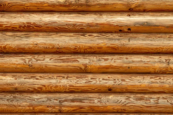 Background log wall, round timber texture.