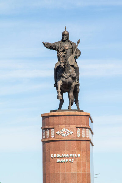 Petropavlovsk, Kazakhstan - June 3, 2019: Monument to the poet and commander Kozhabergen Zhyrau (16631763) at the entrance to the city of Petropavlovsk. Road street summer. Batyr on horseback, stone marble  