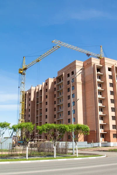 High-rise red brick house with windows, architecture.