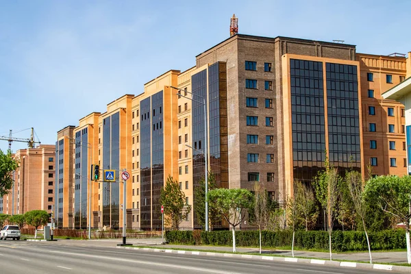 High-rise red brick house with windows, architecture.