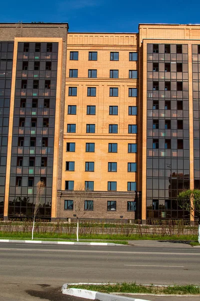 High-rise red brick house with windows, architecture.