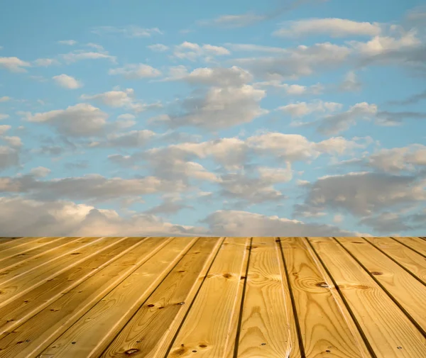 blue sky clouds with wooden walkway