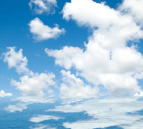 Sea clouds reflected in water