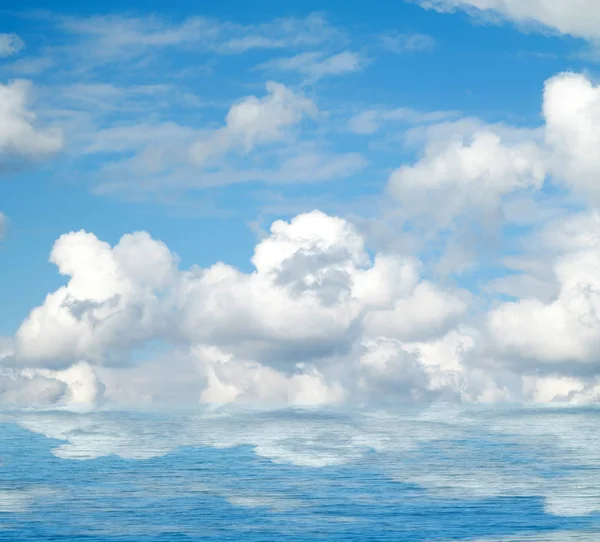 Sea clouds reflected in water