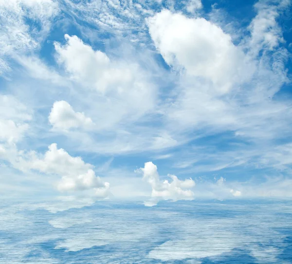 Sea clouds reflected in water