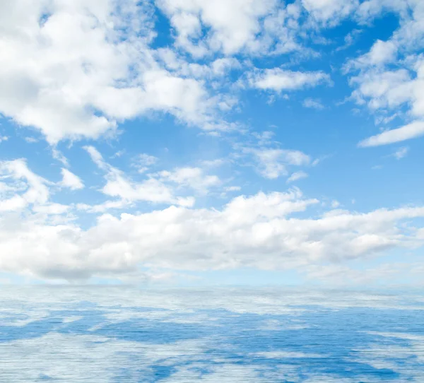 Sea clouds reflected in water