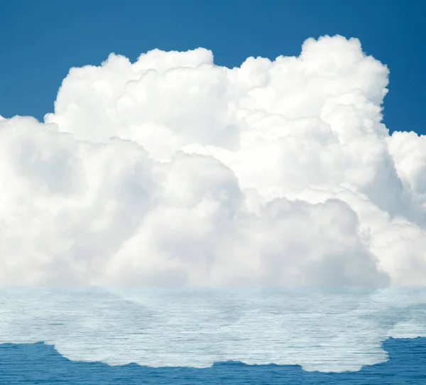 Sea clouds reflected in water