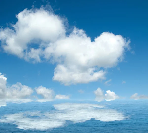 Sea clouds reflected in water