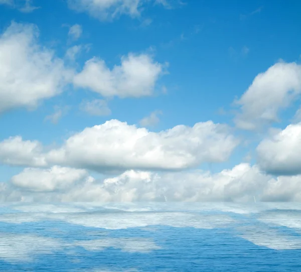 Sea clouds reflected in water