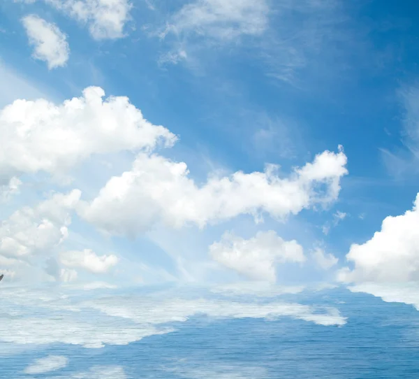 Sea clouds reflected in water