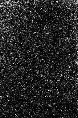 Su sıçramaları, beyaz bokeh, karanlık bir arka planda odak dışında bulanık arka plan.