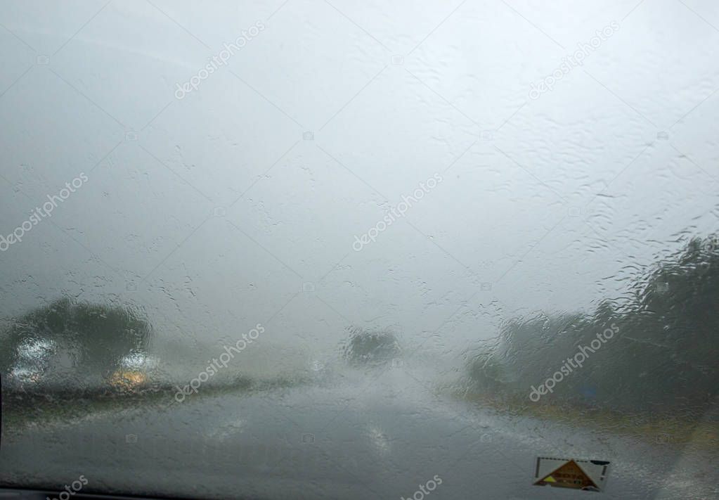 downpour on the highway seen from inside the car