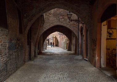 Ferrara, Italy - June 10, 2017: Via delle Volte of Ferrara in the medieval quarter. Emilia-Romagna. Italy.  clipart