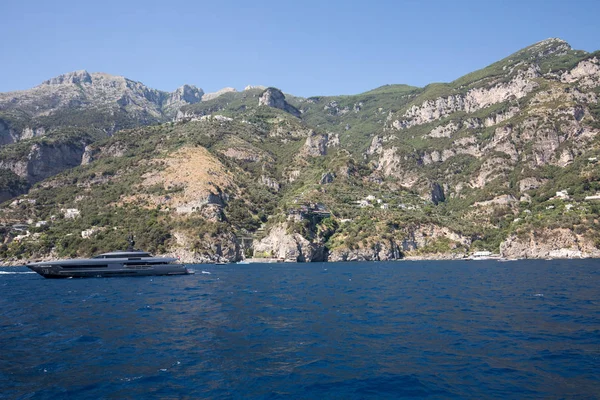 Luxury crewed motor yacht on the Amalfi Coast near Positano, Campania. Italy