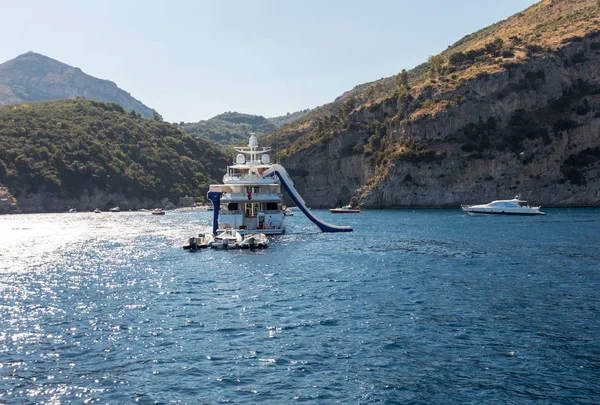 Luxury crewed motor yacht on the Amalfi Coast near Positano, Campania. Italy