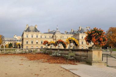 Paris, France - November 2017: the Luxembourg Garden in Paris. Luxembourg Palace is the official residence of  the French Senate.  clipart