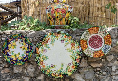 Ravello, Italy - June 16, 2017: a ceramic table top sold in Ravello, Amalfi Coast. Italy clipart