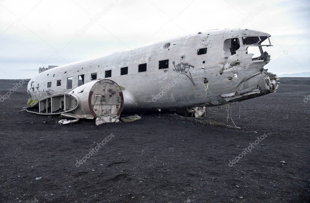 Wreckage of crashed airplane Dakota United States Navy Douglas Super DC-3 on the coast of iceland black sand beach. Solheimasandur, Iceland