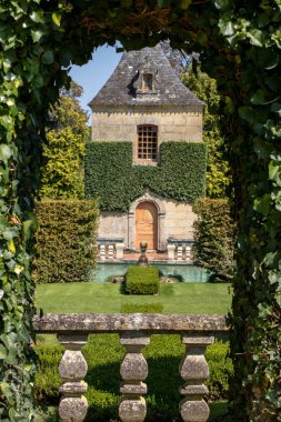 The picturesque Jardins du Manoir d Eyrignac in Dordogne. France  clipart