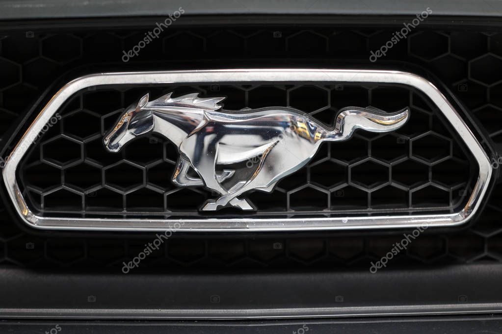 Cracow, Poland - May 18, 2019: Ford Mustang metalic logo closeup on the car displayed at Moto Show in Cracow Poland. Exhibitors present  most interesting aspects of the automotive industry
