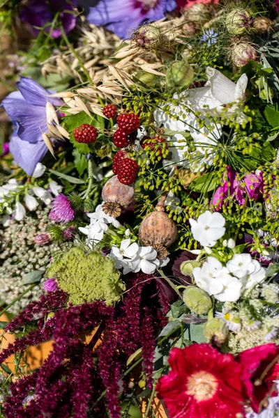 Floristic bouquet of flowers, herbs and fruits that are the symbol of summer