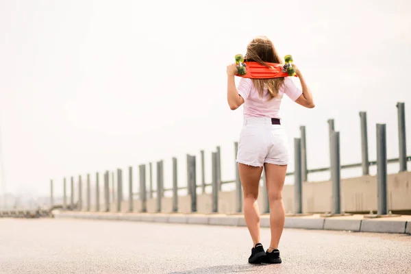 Young Beautiful Blonde Girl Orange Skateboard Bridge — Stock Photo, Image