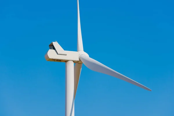 Wind Generator Turbine on the Blue Sky Bacground. Green Renewable Energy Concept. — Stock Photo, Image