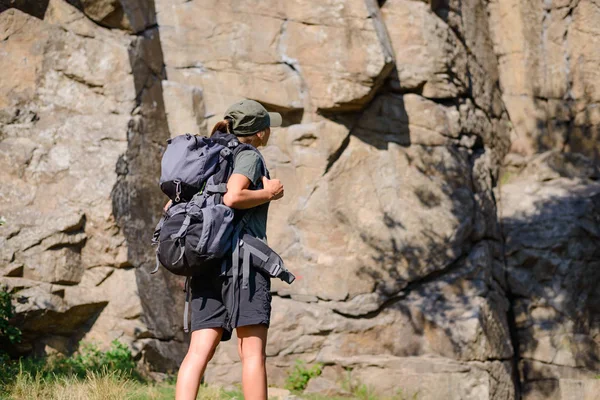 Young Beautiful Woman Hiker with Big Backpack on the Rock Background. Adventure and Travel Concept — Stock Photo, Image