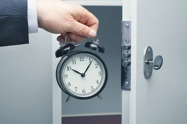 Businessman Puts Alarm Clock Safe — Stock Photo, Image