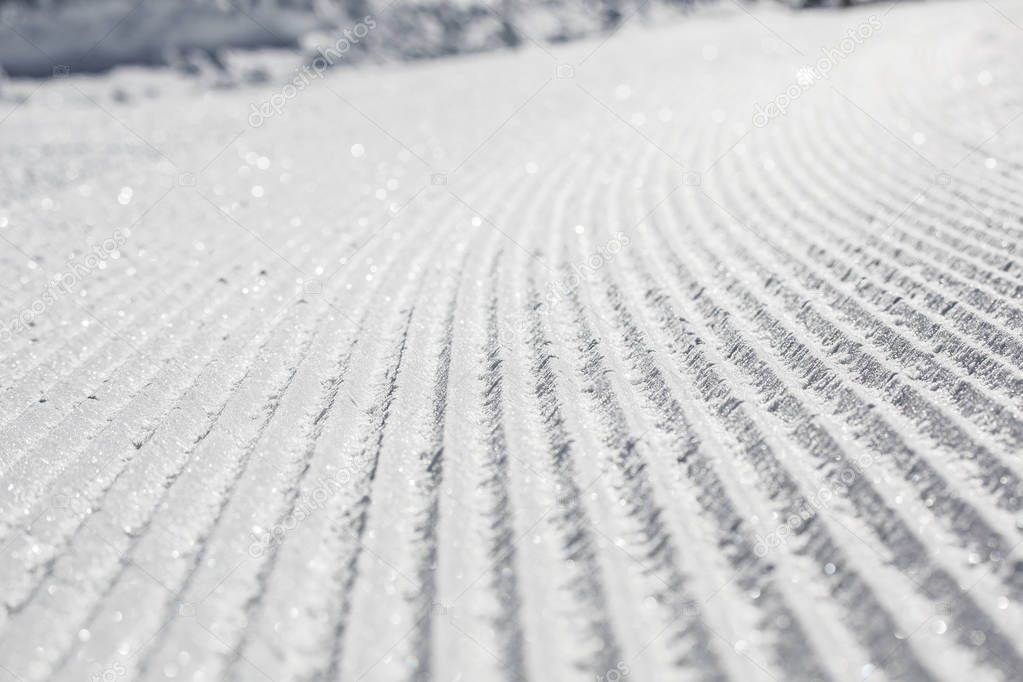 perfectly groomed empty ski track
