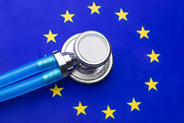 stethoscope with European Union flag. Stethoscope over European Flag