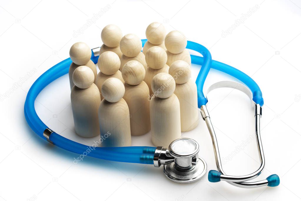 Wooden figures of people and a stethoscope