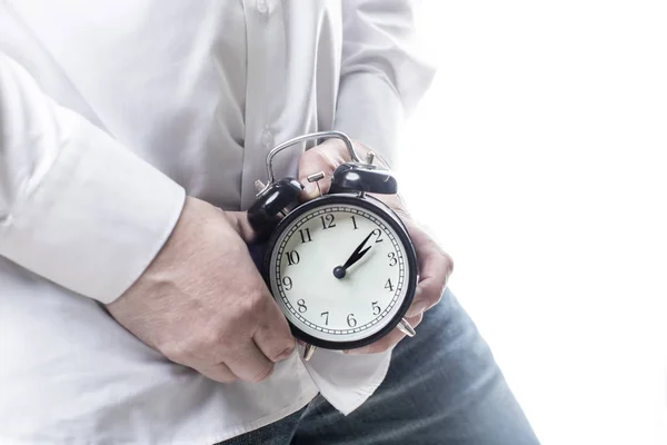 Male hands holding alarm clock on white background Mens health. — Stock Photo, Image