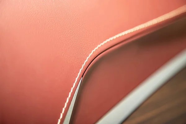 Leather trim car closeup, seam