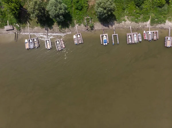 wooden jetty with colorful boats, Aerial drone photo