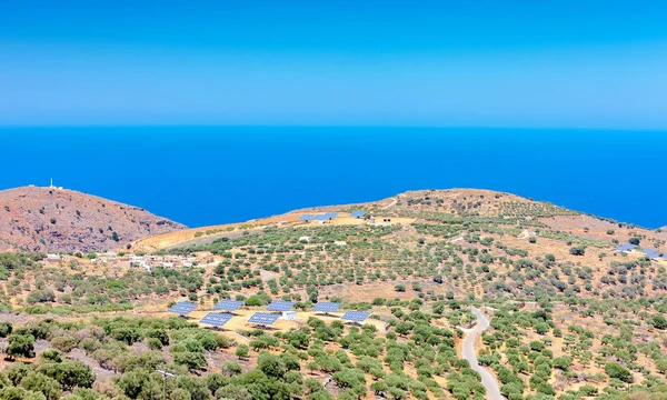Solar panels in olive grove. Crete. Greece — Stock Photo, Image