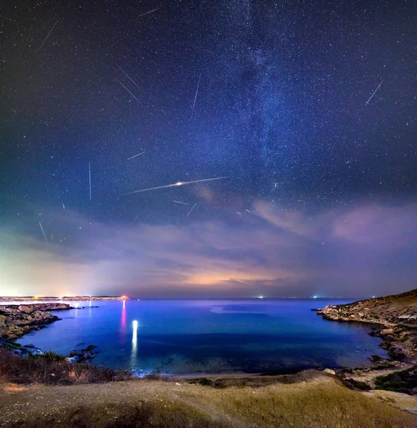 A sky full of shooting stars during the Perseid showers 2018 over Mgiebah Bay in Malta