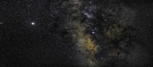 Saturn, Pluto and Jupiter close to one of the most beautiful parts of the Milky Way. To their right, starting from the top one can also see the M16 Eagle Nebula, M17 Omega Nebula, Sagittarius Star Cloud, M20 Trifid Nebula, M10 Nebula, and more.