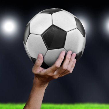 Futbol topu tutan adam.