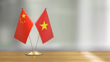 Çince ve Vietnamca bayrak çifti çözünmüş arka planda bir masanın üzerinde 