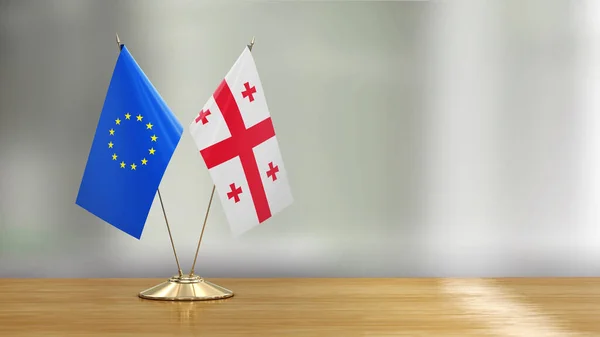 União Europeia Par Bandeira Georgiana Uma Mesa Sobre Fundo Desfocado — Fotografia de Stock