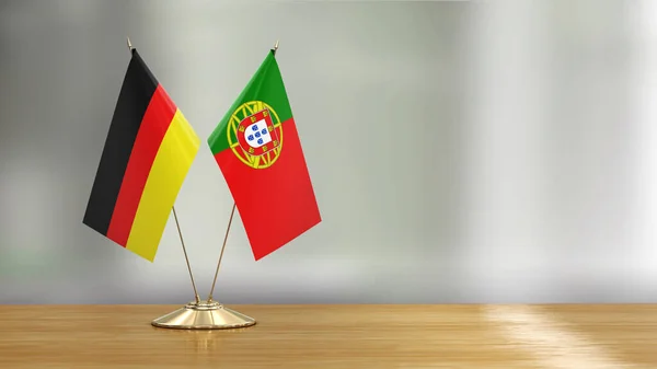 Portuguese German Flag Pair Desk Defocused Background — Stock fotografie