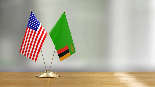 Пара Американских Замбийских Флагов Столе Разряженном Фоне — стоковое фото