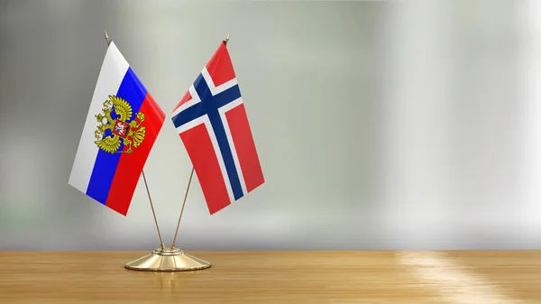 Пара Норвезьких Російських Прапорів Столі Над Обезголовленим Фоном — стокове фото