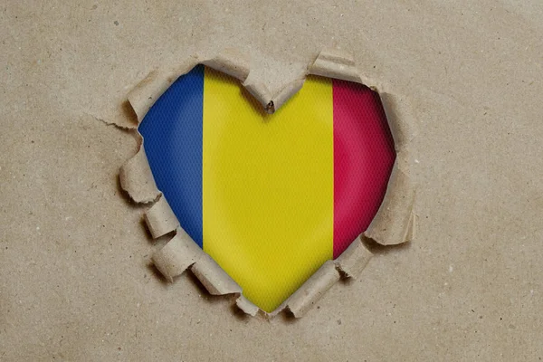 Heart Shaped Hole Torn Paper Showing Chad Flag — Stock Photo, Image