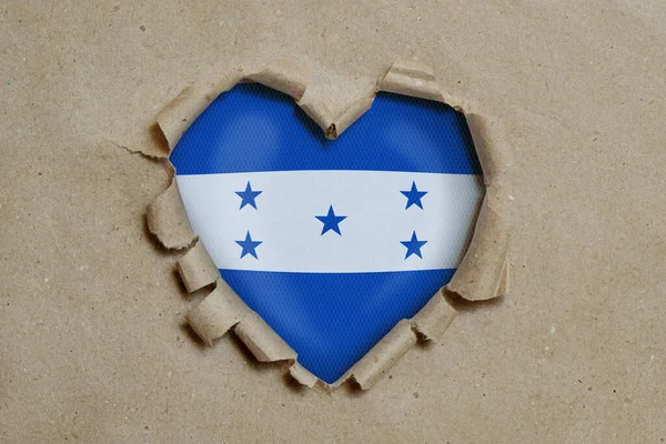 Agujero Forma Corazón Rasgado Través Papel Mostrando Bandera Honduras — Foto de Stock