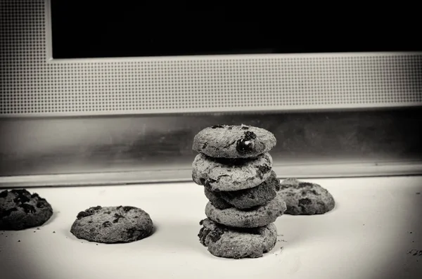 Cookies in front of a computer, a concept