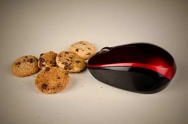 Mouse eating cookies, a funny technology concept