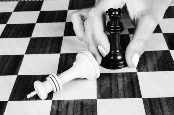 Female hand playing chess — Stock Photo, Image